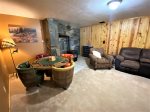 Lower level Family Room with TV, poker table, Pellet Stove